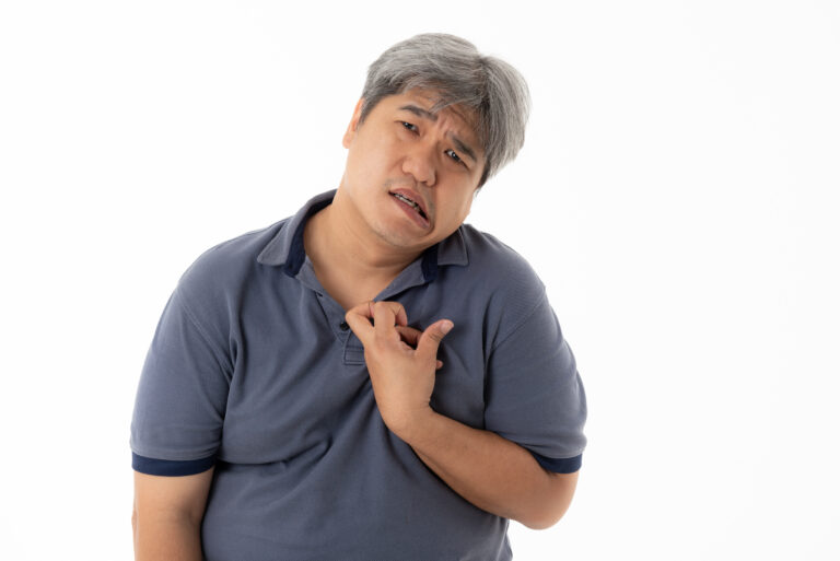 Asian middle-aged man are Patients, His hands are kinking due to a nervous system illness and paralysis, On white isolated background, to health concept.